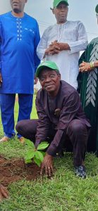 Professor Ayoade Olayiwola Ogunkunle, Pro-Chancellor and Chairman of Council planting a tree to mark the day